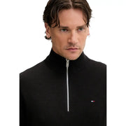 Tommy Hilfiger Jeans, Herren, schwarzer gerippter Strickpullover mit halbem Reißverschluss aus 100 % Baumwolle mit silbernem Reißverschluss und Logo auf der Brust