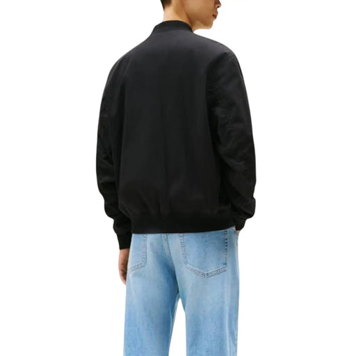 Tommy Hilfiger Jeans men black organic cotton bomber jacket with ribbed cuffs and waistband and zip closure