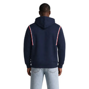 Tommy Hilfiger Jeans Herren-Hoodie aus blauer Bio-Baumwolle mit marineblauem Korpus und rot-weiß gestreiften Ärmeleinsätzen.
