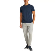 Men’s navy blue short-sleeve cotton T-shirt with chest pocket and light gray athletic pants