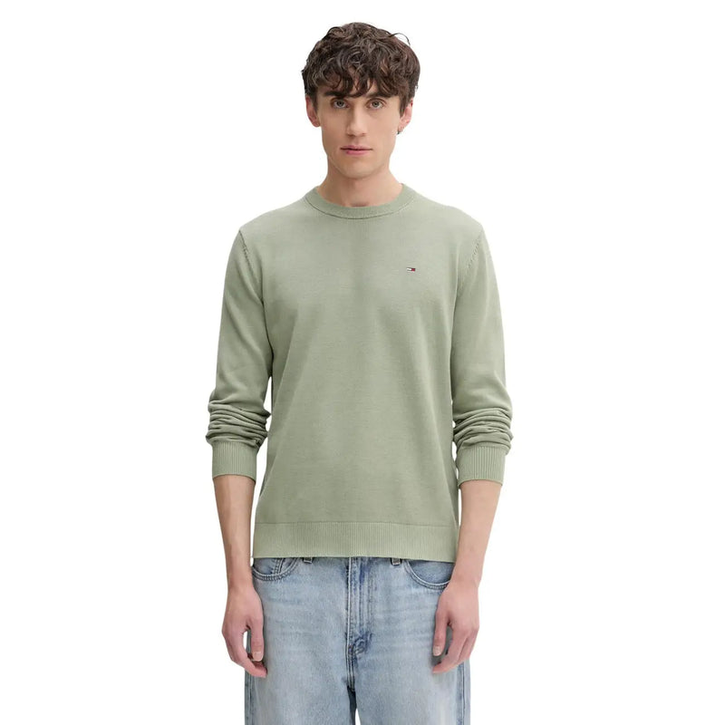 A men’s olive green organic cotton knit sweater by Tommy Hilfiger Jeans with ribbed cuffs and an embroidered logo