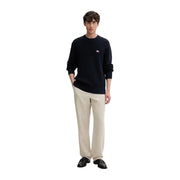 Navy blue ribbed knit sweater with small left chest logo made from organic cotton by Tommy Hilfiger Jeans men knitwear