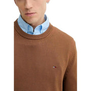 Brown cotton knit sweater with round neck and small embroidered Tommy Hilfiger logo on left chest for men