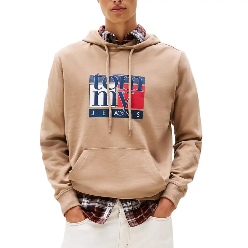 Men’s beige Tommy Hilfiger Jeans hoodie with plaid shirt underneath displayed in product image