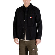 Black tommy hilfiger men’s work jacket with button closures and embroidered logo on chest for casual wear