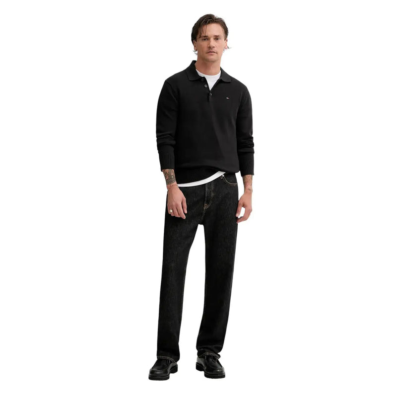 Black long-sleeved slim polo shirt with small embroidered logo made of organic cotton by Tommy Hilfiger Jeans