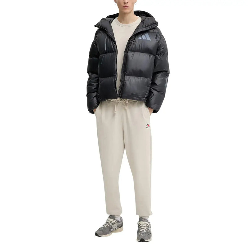 Black adidas puffer jacket with hood and quilted design shown with Tommy Hilfiger Jeans men t-shirt