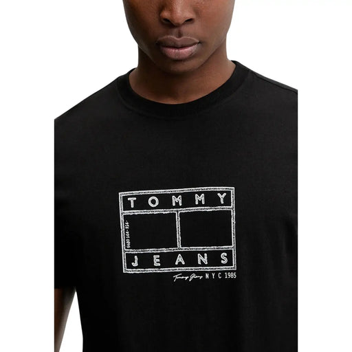 Black Tommy Hilfiger jeans men t-shirt with white chalk-style Tommy Jeans NYC 1985 logo on front