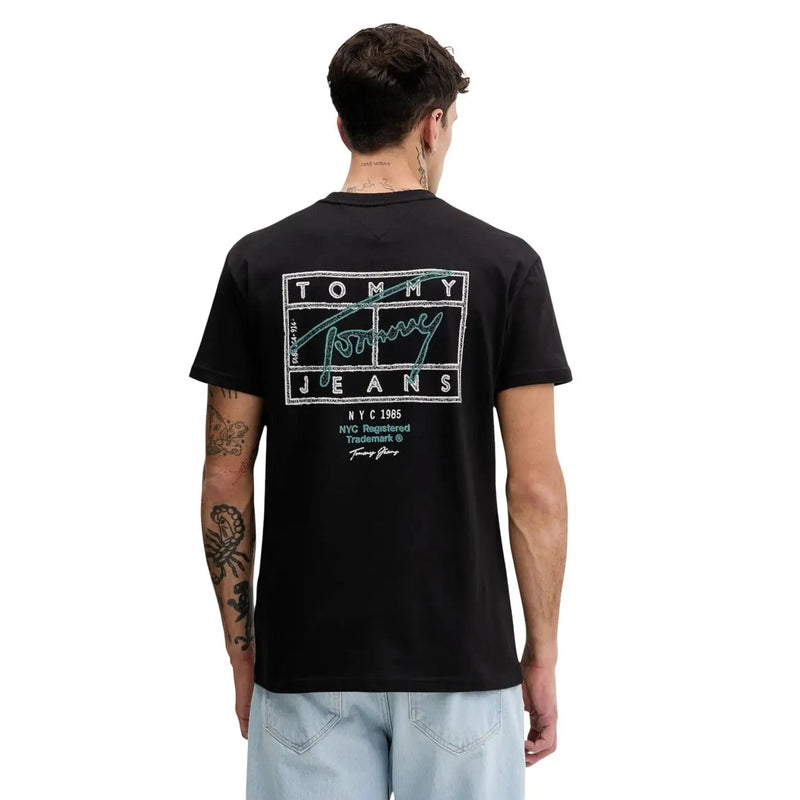 Back side of black tommy hilfiger jeans men t-shirt with retro teal and white logo lettering in cotton fabric