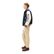 Marineblaue und weiße Collegejacke mit rot-weiß-blau gestreiften Borten und der aufgestickten Zahl 85 am Ärmel für Herren von Tommy Hilfiger