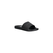 Schwarze Tommy Hilfiger Pantolette aus Polyurethan mit minimalistischem Design und dezentem Logo am Riemen, Größe 41