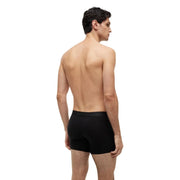 Schwarze Calvin Klein Boxershorts mit glattem, figurbetontem Design, von hinten gesehen, aus schwarzer Bio-Baumwolle von Tommy Hilfiger.