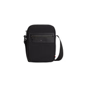 Schwarze Tommy Hilfiger Mini-Reportertasche für Herren aus Kunstleder mit strukturierter Vorderseite und Reißverschlussdetail, Größe B 15 cm