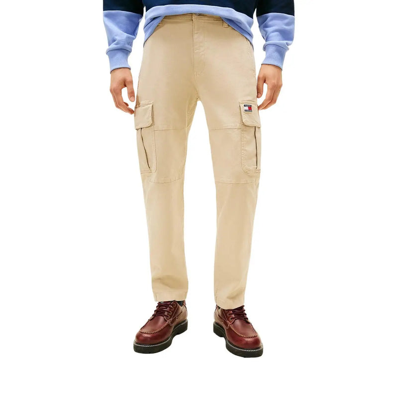 Beige tommy hilfiger jeans men trousers featuring cargo style with multiple pockets and logo patch on the thigh