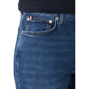 Dark blue slim fit denim jeans made of organic cotton with silver buttons and a flag patch on the back pocket