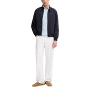 Navy blue bomber jacket with black accents and a tommy hilfiger logo.