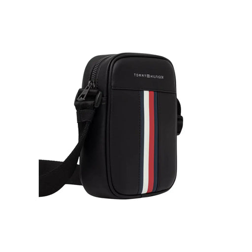 Tommy Hilfiger Schwarze Metro Mini Reportertasche für Herren mit rot-weiß-blauen vertikalen Streifen auf der Vorderseite