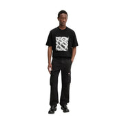 Black cotton lycra tommy hilfiger men otis canvas jeans featuring a black short-sleeved t-shirt with bold white geometric pattern