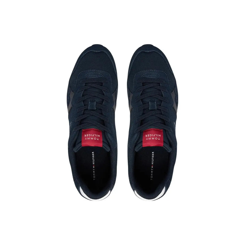 Dark navy Tommy Hilfiger men sneakers in polyester with red branding accents and white rubber soles