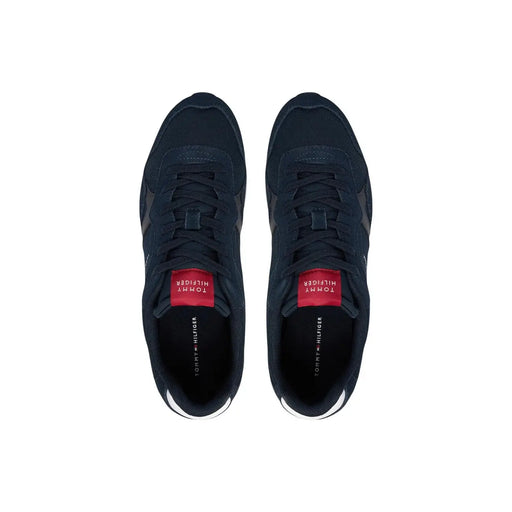 Dark navy Tommy Hilfiger men sneakers in polyester with red branding accents and white rubber soles