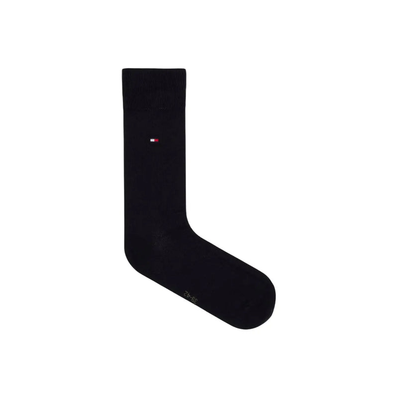 Black cotton tommy hilfiger men’s sock with small red white and blue flag logo for casual and dress wear