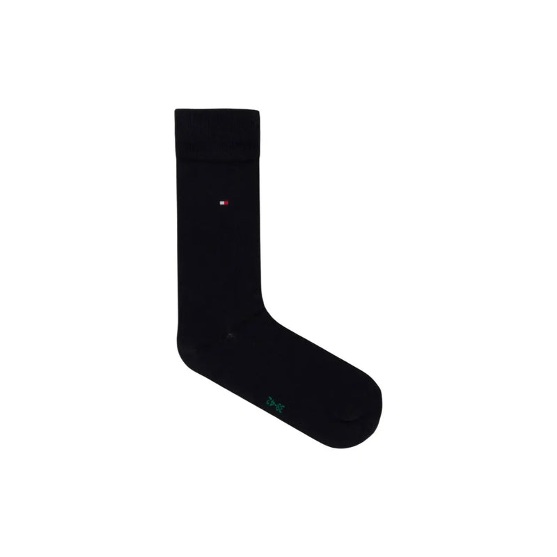 Black tommy hilfiger men sock in cotton blend with small logo on side and green text near the toe