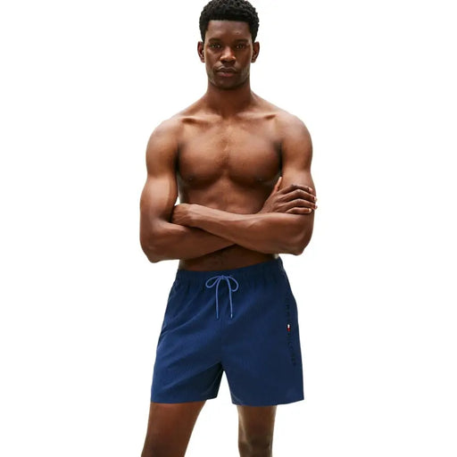 Tommy Hilfiger men swimwear navy blue textured swim trunks with light blue drawstring and side logo detail