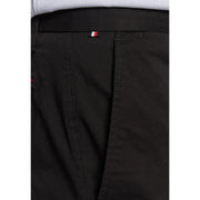 Black Tommy Hilfiger men trousers with subtle woven texture and red white and blue striped waistband tag