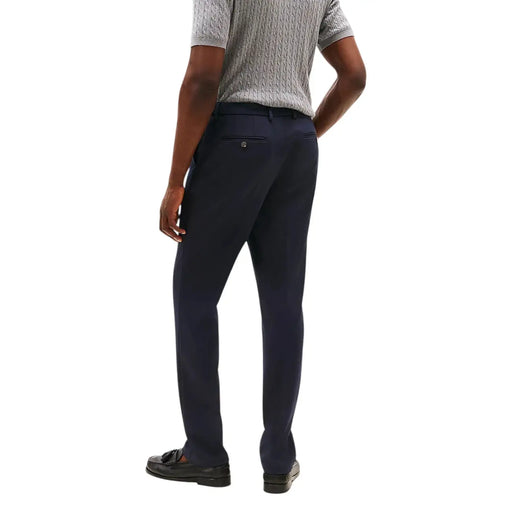 Tommy Hilfiger men trousers in dark navy blue with a sleek slim-fit cut and subtle textured fabric