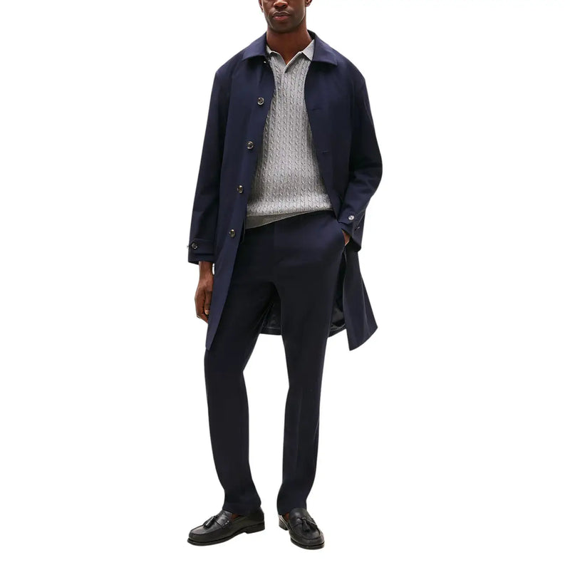 Navy blue wool overcoat with button closures and classic collar featured with Tommy Hilfiger men trousers