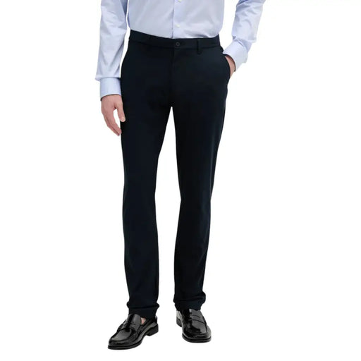 Black tailored Tommy Hilfiger men trousers with a sleek straight-leg cut and subtle creasing at the waistband