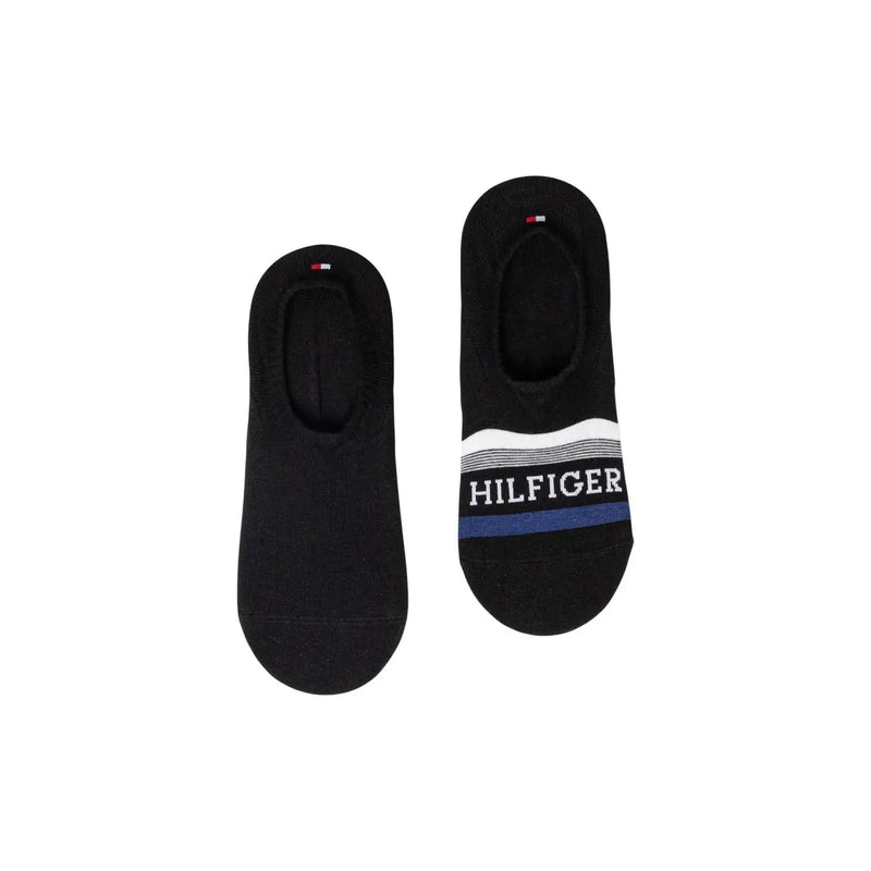 Black tommy hilfiger no-show socks with white and navy striped band and bold brand name for men underwear use