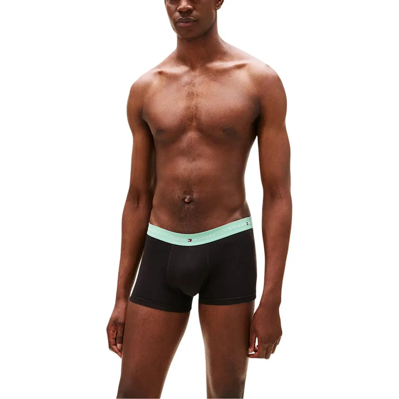 Black Tommy Hilfiger boxer briefs with light teal elastic waistband featuring the Tommy Hilfiger logo