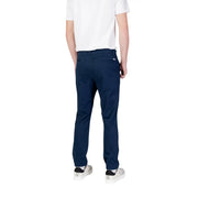 Back side view of tommy hilfiger men’s navy blue chino pants with subtle woven texture and brand logo on pocket