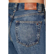 Blue denim tommy hilfiger women jeans showing the back with brown leather brand patch and flag logo on pocket
