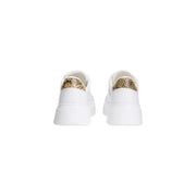 Back view of Tommy Hilfiger women leather white platform sneakers with gold-toned snake skin heel tab detail