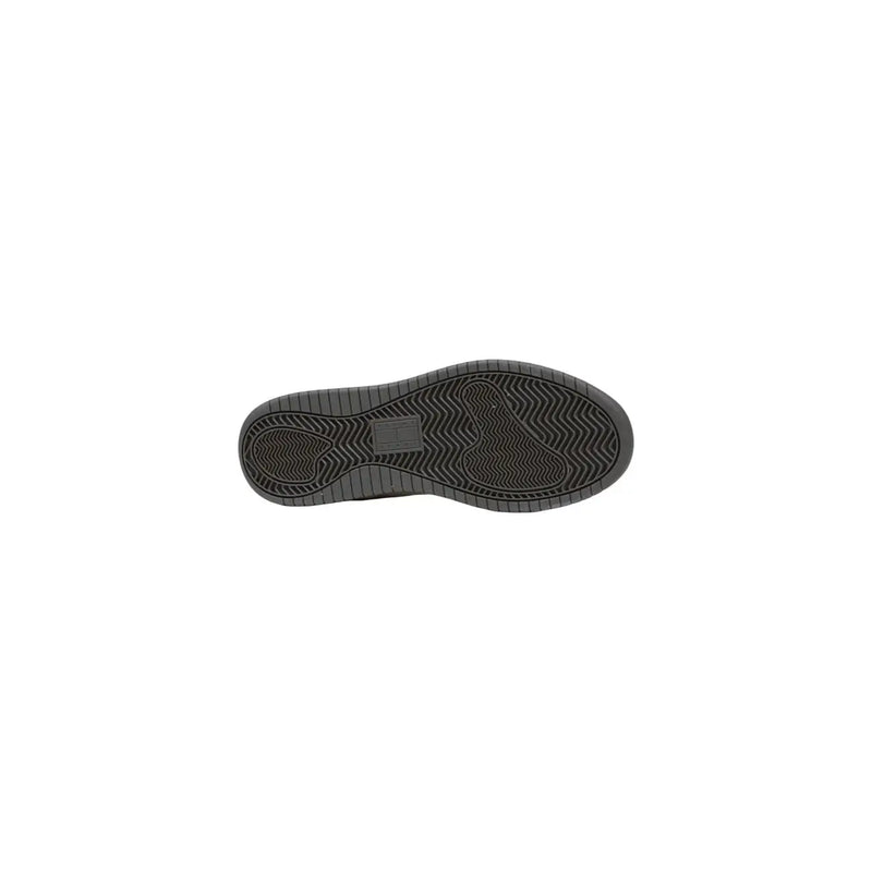 Black rubber shoe sole with textured wavy tread and rectangular label on the back side of tommy hilfiger women sneakers white suede laces