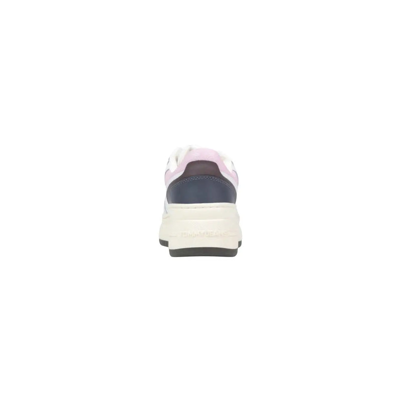 A stylish tommy hilfiger women sneaker with white suede laces and navy blue, soft pink, and white chunky sole design