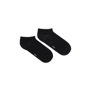 Schwarze Baumwolle Tommy Hilfiger Damen-Knöchelsocken mit dezentem weißen Schriftzug und einem schwachen Muster im Fersenbereich