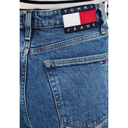 Blaue Tommy Hilfiger Damenjeans mit weitem Bein und klassischem Markenpatch im rot-weiß-blauen Flaggenmuster.