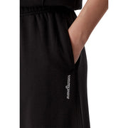 Schwarze Tommy Hilfiger Damen-Jogginghose aus Baumwolle mit weitem Bein, gerippter Struktur und dezentem, weiß gesticktem Logo an der Seitennaht