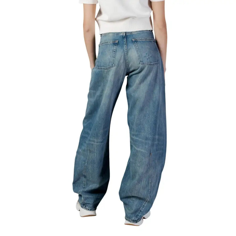 Back side of tommy hilfiger women’s wide-leg medium-wash blue organic cotton denim jeans with subtle stitching