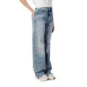 Tommy Hilfiger women’s blue organic cotton jeans with a relaxed wide-leg cut and subtle distressing details