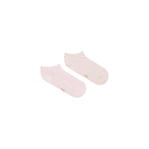 A pair of tommy hilfiger women’s pink cotton ankle socks with soft texture and small red branding on the side