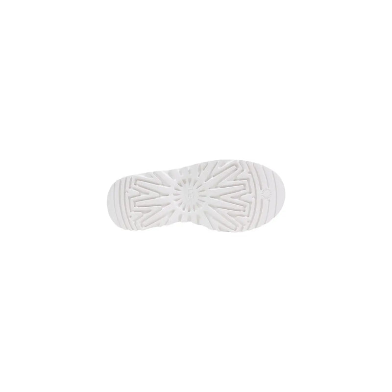 White rubber sole with geometric starburst tread pattern on ugg women beige leather platform boots