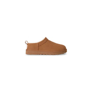 Tan suede ugg women leather slip on shoes with plush shearling lining and rubber sole for spring summer use