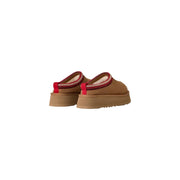 Ugg women suede platform slippers in beige featuring tan slip-on mules with red trim and chunky rubber sole