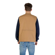 Brown utility vest with pockets and zipper, likely made of canvas or similar durable material.