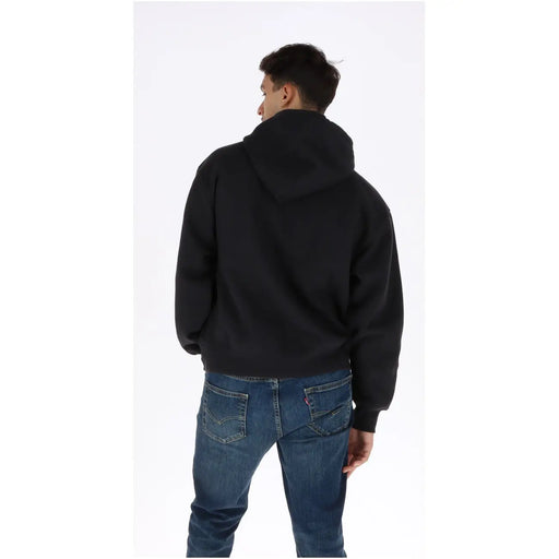Schwarzer Vans Herren-Hoodie aus Baumwolle mit weicher, lässiger Passform und gerippten Bündchen in Schwarz.