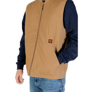 Vans Herrenweste, beige, mit langem Reißverschluss, aus Baumwollmischgewebe mit hellbraunem Farbton und kleinem orangefarbenem Brustaufnäher